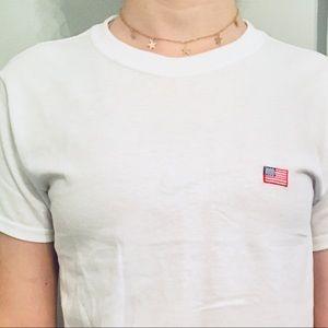 Cotton white t-shirt with American flag patch.